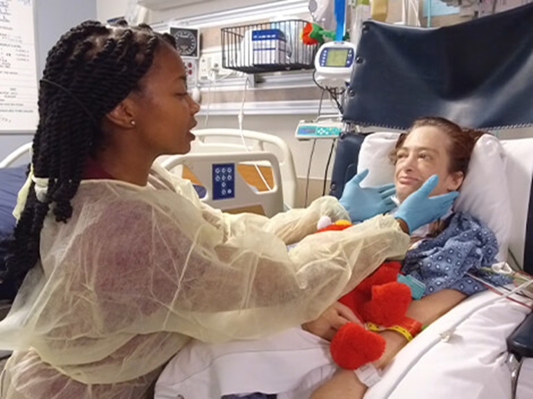 Patient with a medically complex condition being treated by a therapist